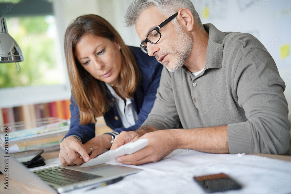 Designer and architect working together on project Designer and architect working together on project