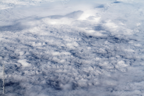 Fototapeta Naklejka Na Ścianę i Meble -  Sunrise above clouds from airplane window