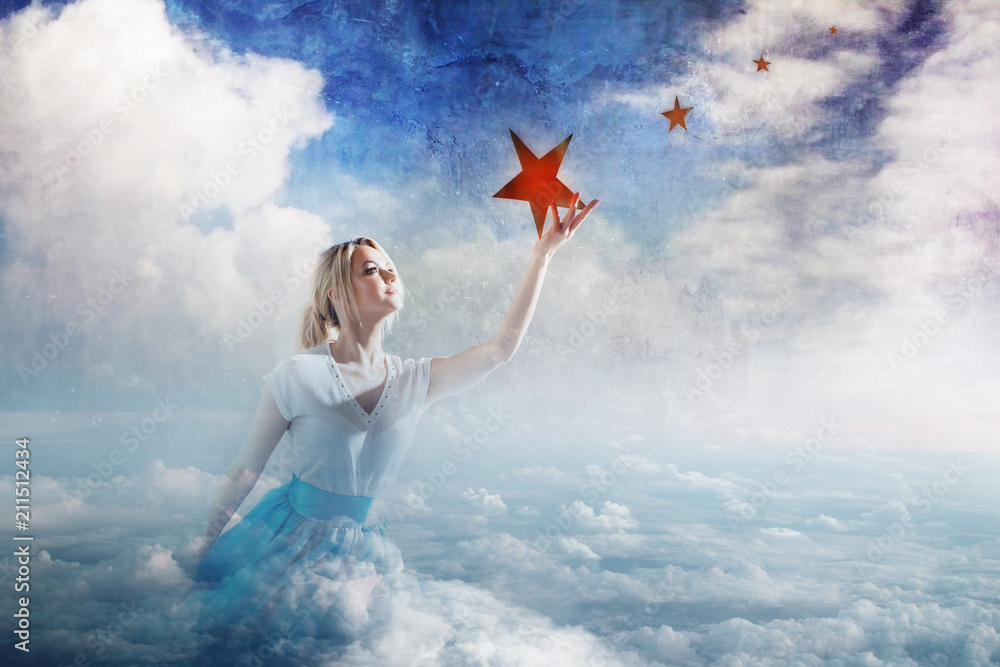 Young attractive woman Sitting on a cloud reaching for the star. Take a star from the sky, dreams and plans, concept Young attractive woman Sitting on a cloud reaching for the star. Take a star from the sky, dreams and plans, concept