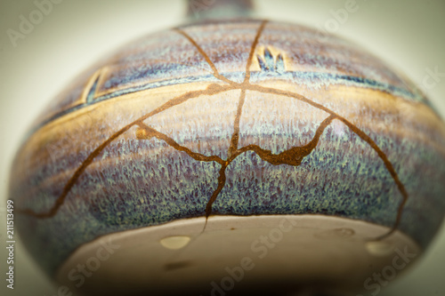 This is a piece of pottery that I am repairing using the Japanese art form of kintsugi with jinoko powder and urushi lacquer at this middle stage of repair.