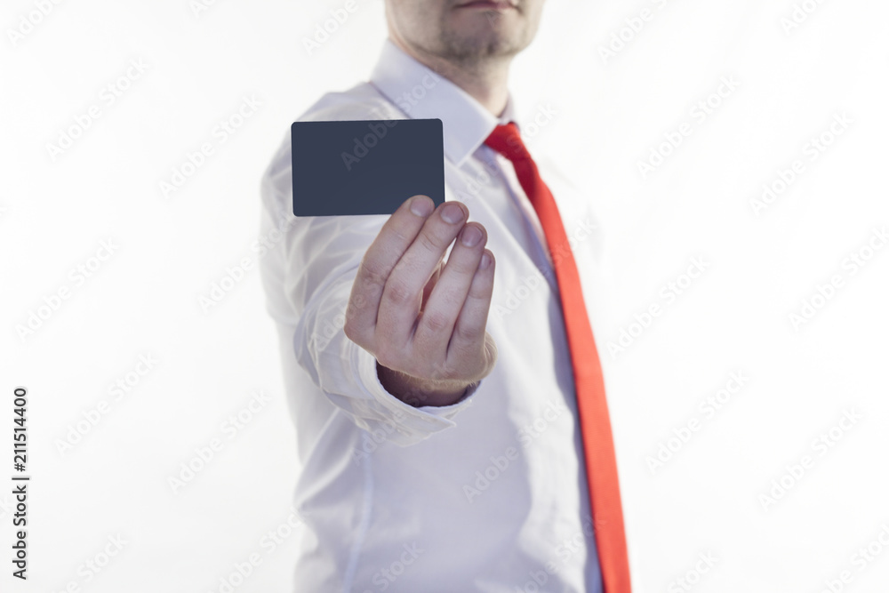 A man in a white shirt and red tie is holding a clean credit card for the inscription, white background