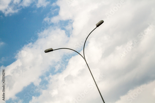 Street Light Pole Against Cloudy Blue Sky
