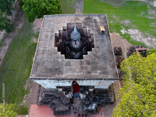 High angle view Buddha statue at Wat Si Chum, Sukhothai historical park, Thailand, Unesco world heritage. photo