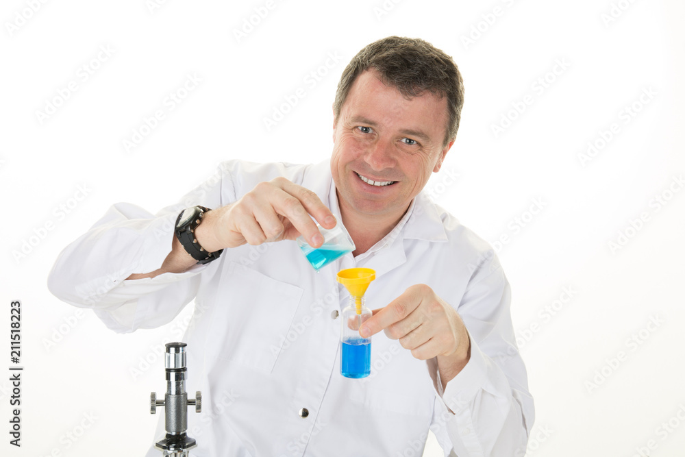 Handsome man medical doctor in white coat is looking at camera and smiling in laboratory Handsome man medical doctor in white coat is looking at camera and smiling in laboratory