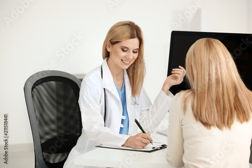 Female doctor consulting ma...