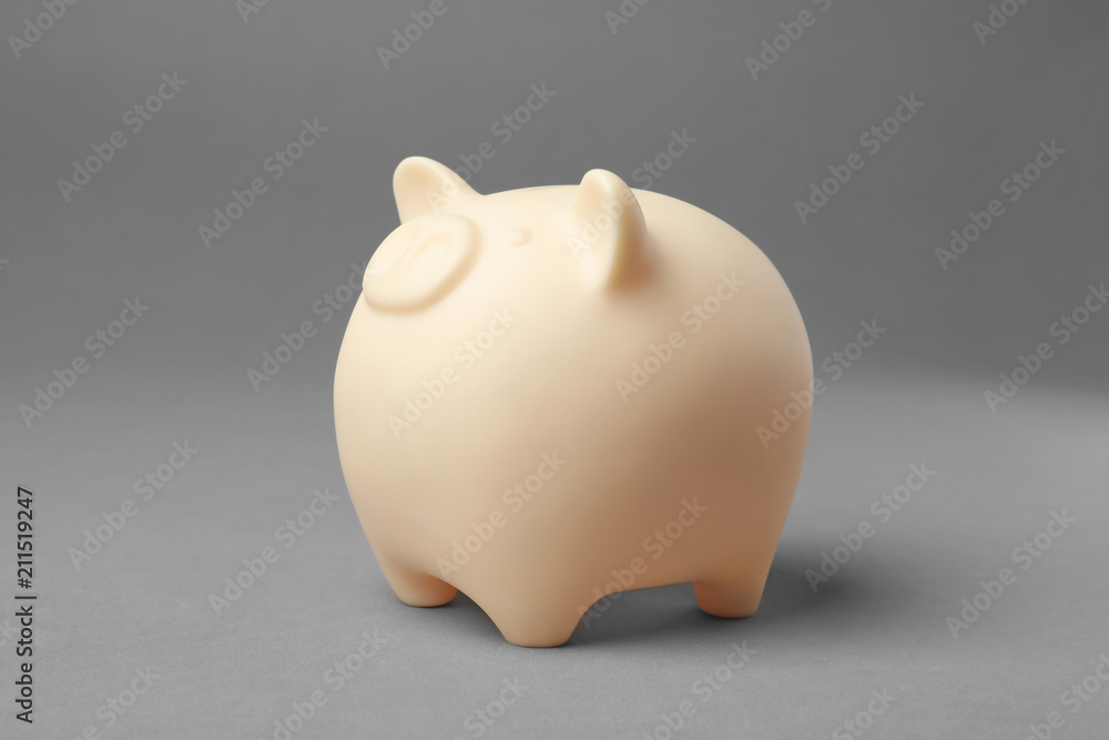 Cute piggy bank on gray background Cute piggy bank on gray background