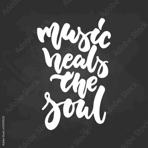 Music heals the soul - hand drawn Musical lettering phrase isolated on the black chalkboard background. Fun brush chalk vector quote for banners, poster design, photo overlays.