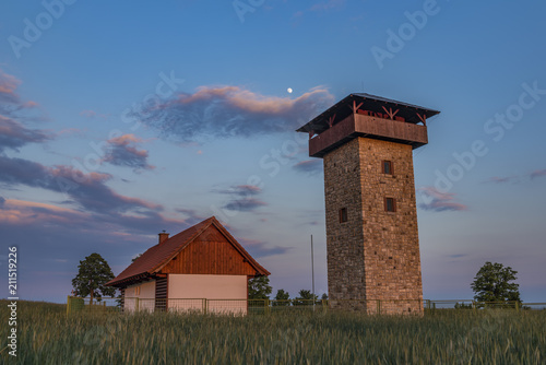 Color sunset near Roprachtice village with observation tower
