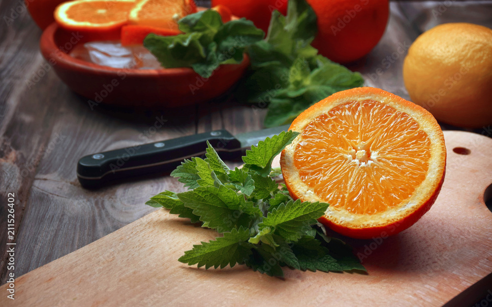 Fresh fruits on a wooden table. Close-up. The concept of proper nutrition and lifestyle. Preparation of refreshing water with ice and fruit, mint. Fresh fruits on a wooden table. Close-up. The concept of proper nutrition and lifestyle. Preparation of refreshing water with ice and fruit, mint.