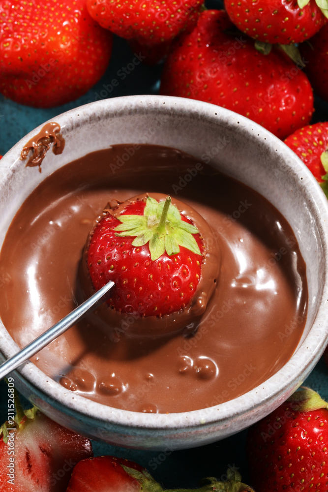 Fondue with Melting chocolate or melted chocolate and strawberry. Fondue with Melting chocolate or melted chocolate and strawberry.