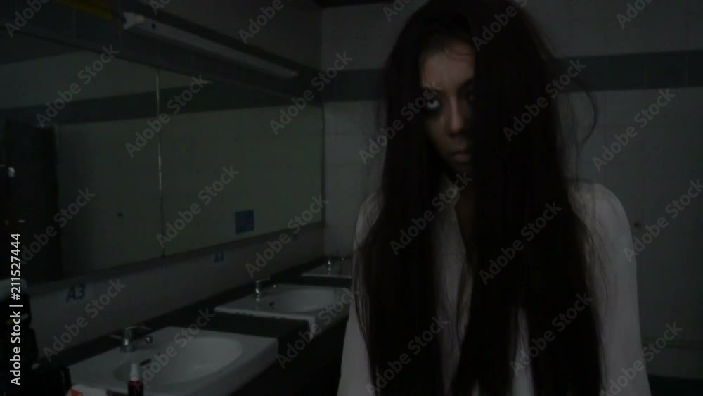 Portrait of asian woman make up ghost face,Horror scene,Scary background,Halloween poster Portrait of asian woman make up ghost face,Horror scene,Scary background,Halloween poster