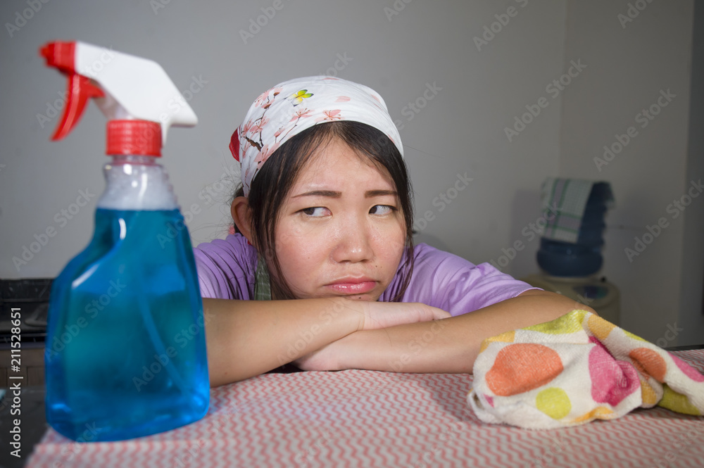 young pretty overworked and frustrated Asian Chinese service maid woman working domestic cleaning and washing home kitchen stressed and upset young pretty overworked and frustrated Asian Chinese service maid woman working domestic cleaning and washing home kitchen stressed and upset