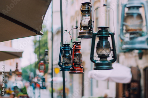 Vintage gas lamps weigh in the old European city. The concept of decor in the restaurant. Intagram filter.