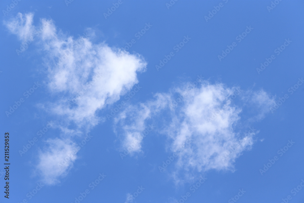 A cloud in the blue sky. Small clouds, sunny weather. A cloud in the blue sky. Small clouds, sunny weather.
