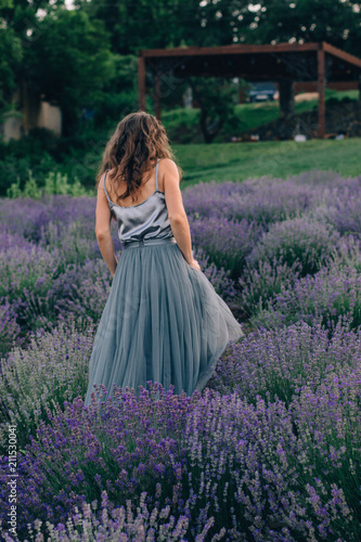 the girl runs around the lavender field
