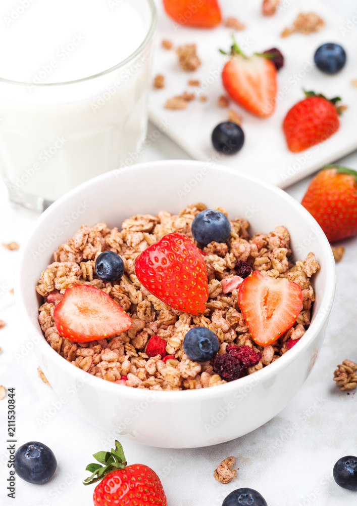 Bowl of healthy cereal granola with strawberries