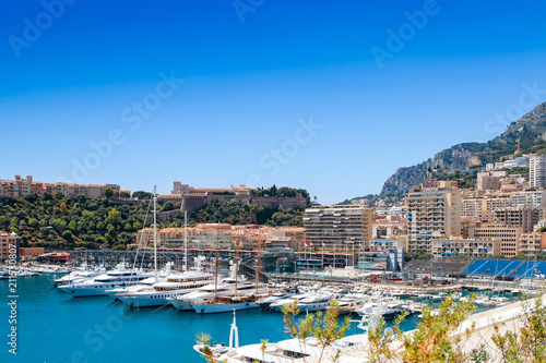 Fototapeta Naklejka Na Ścianę i Meble -  Many motor yachts docked in Fontvielle harbour on a sunny day, Monaco.