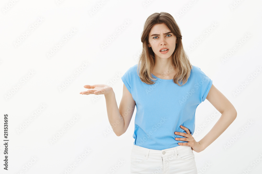 What is your point dude. Portrait of intense pissed attractive woman with fair hair, raising palm in clueless and questioned gesture, holding hand on waist, lifting eyebrow, being confused and unhappy What is your point dude. Portrait of intense pissed attractive woman with fair hair, raising palm in clueless and questioned gesture, holding hand on waist, lifting eyebrow, being confused and unhappy