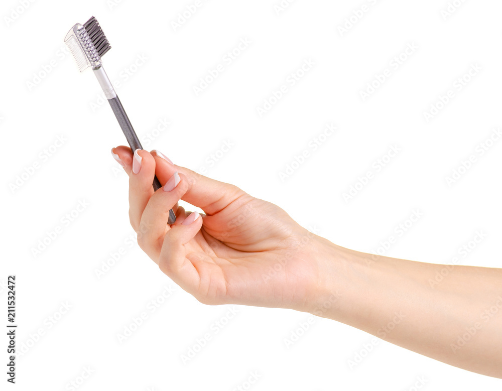 Brush for eyebrows in hands on a white background Isolation Brush for eyebrows in hands on a white background Isolation