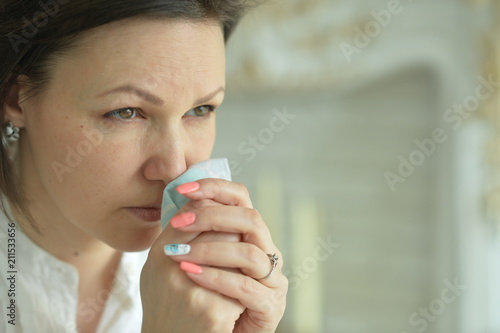 Fototapeta Naklejka Na Ścianę i Meble -  Sick Young woman crying