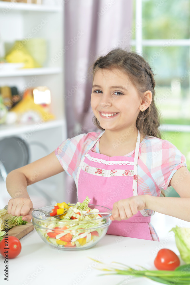 Cute girl preparing delicious fresh salad Cute girl preparing delicious fresh salad