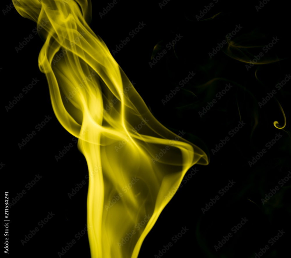 Obraz premium Yellow smoke on black background