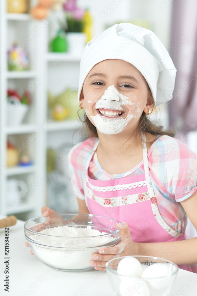 Cute girl baking in the kitchen at home Cute girl baking in the kitchen at home
