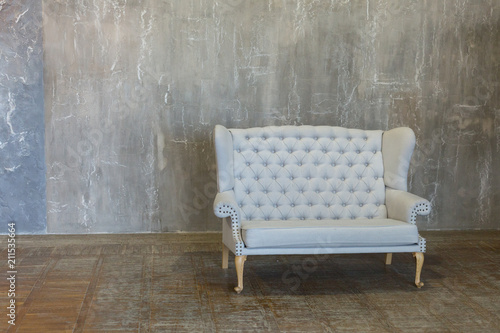 the gray sofa. sofa against a gray wall