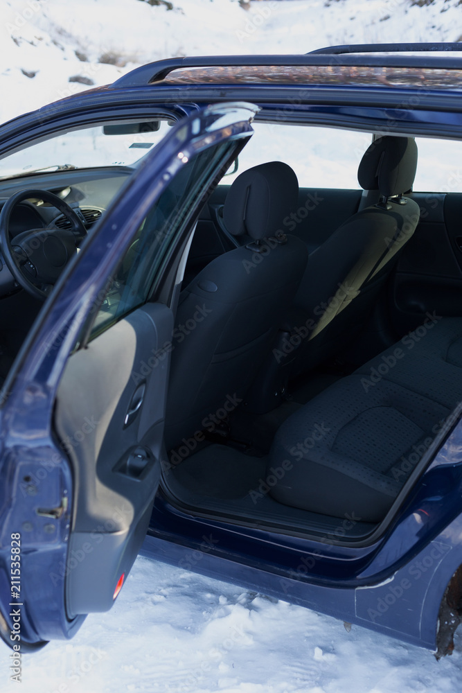 front passenger seats in the car. the car is blue. car interior. passenger car seat