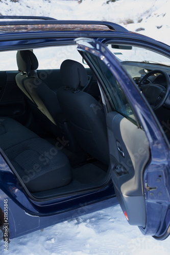 front passenger seats in the car. the car is blue. car interior. passenger car seat