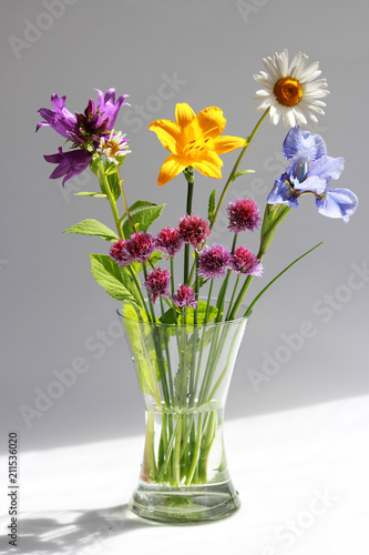 Wallpaper Mural a bouquet of different wild field and garden flowers: chamomile, bell, lily, chives, iris. Torontodigital.ca