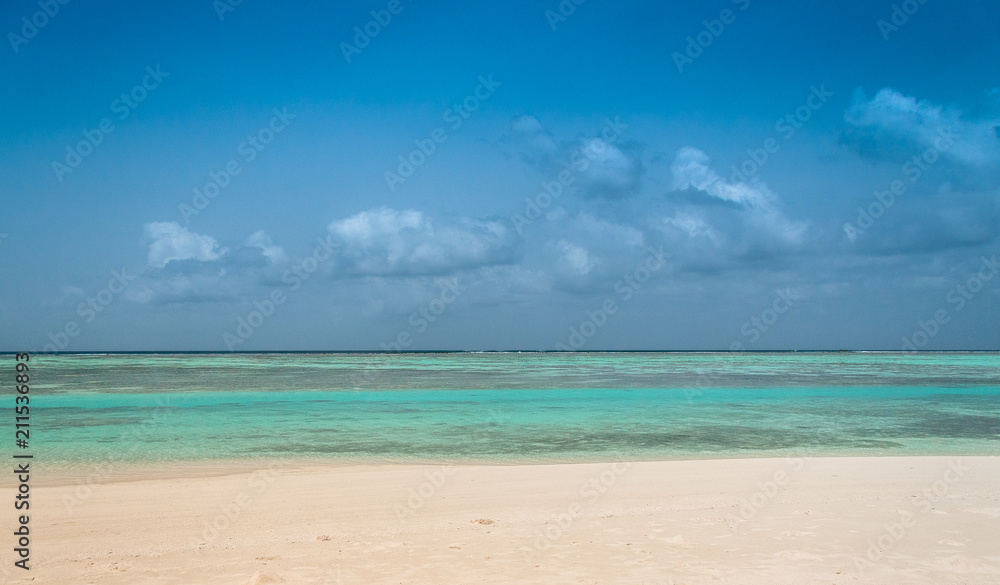 Maldives beautiful beach background white sandy tropical paradise island with blue sky sea water ocean	