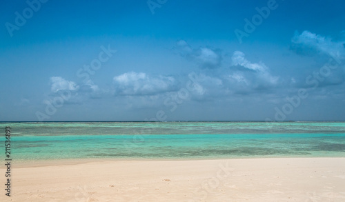 Maldives beautiful beach background white sandy tropical paradise island with blue sky sea water ocean 