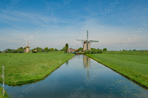 Quadro em tela Two wind mills in a polder landscape near the village of Maasland, the Netherlands