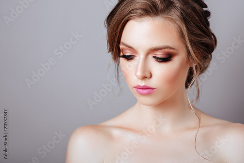 Fashion model posing at studio with makeup