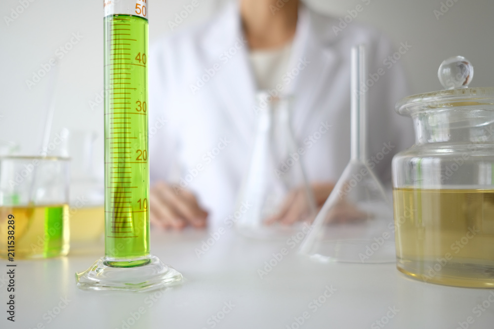 doctor woman scientist making herbal medicine in lab with herb leaves vitamin supplements mineral alternative treatment research. doctor woman scientist making herbal medicine in lab with herb leaves vitamin supplements mineral alternative treatment research.