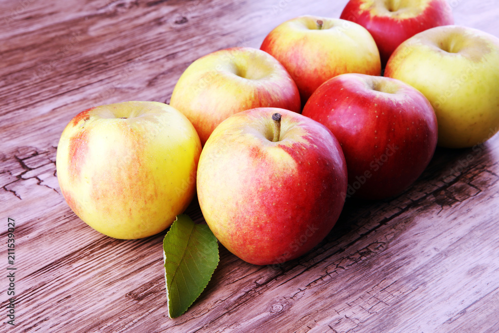 Ripe red apples on wooden background summer concept Ripe red apples on wooden background summer concept