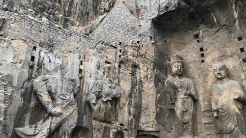 Panning view of the main Buddha statues in Longmen Grottoes,Luoyang, China