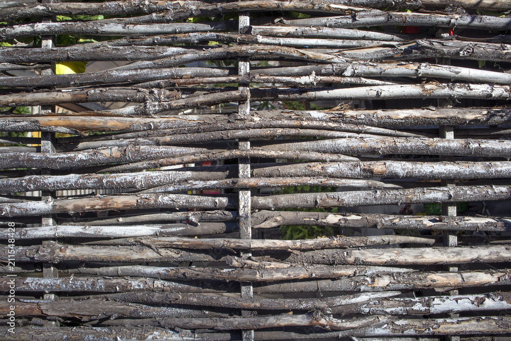 Fragment of old rural wattle of withered twigs, may be used as background or texture Fragment of old rural wattle of withered twigs, may be used as background or texture