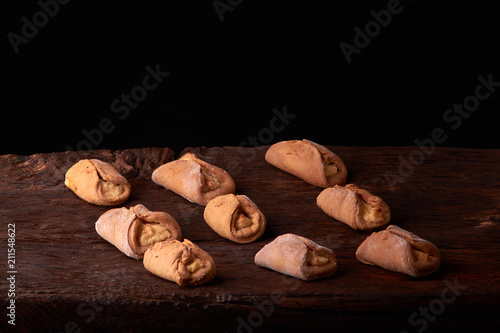 Cookies with cottage cheese - sochnik on wooden desk. Classic colors. Warm photo photo