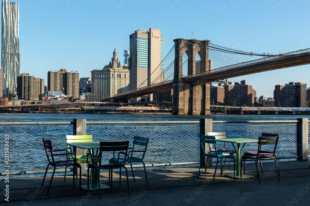 New York City / USA - JUN 25 2018: Brooklyn Bridge Park with Lower Manhattan skyline in early morning