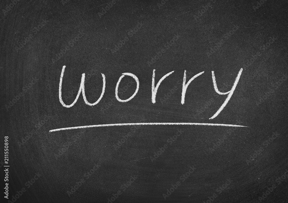 Obraz premium worry concept word on a blackboard background