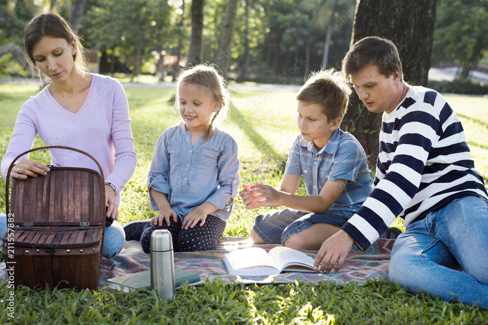 Family having a picnic in the park Family having a picnic in the park