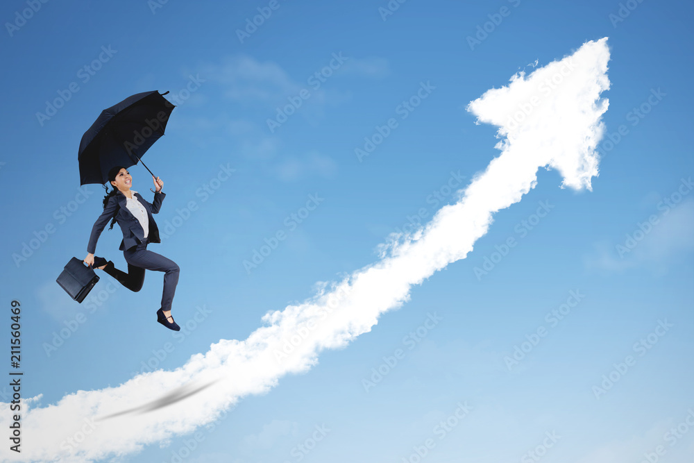 Asian businesswoman jumping with upward arrow Asian businesswoman jumping with upward arrow