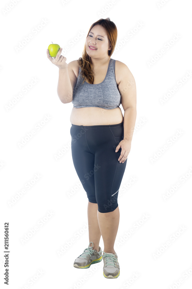 Beautiful fat woman holding fresh apple Beautiful fat woman holding fresh apple