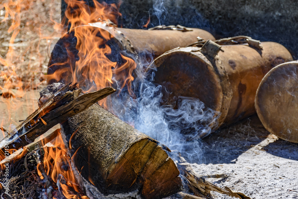 Fototapeta premium Ethnic drums used in religious festival in Lagoa Santa, Minas Gerais near the fire so that the leather stretch and adjust the sound of the instrument