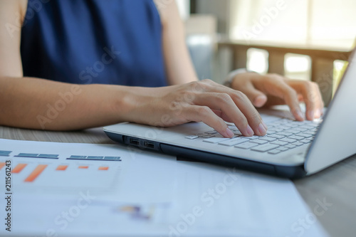 Businesswoman using laptop for analysis maketing plan, Manager calculate financial report and graph chart.  Business, Finance and Accounting concepts © Jo Panuwat D
