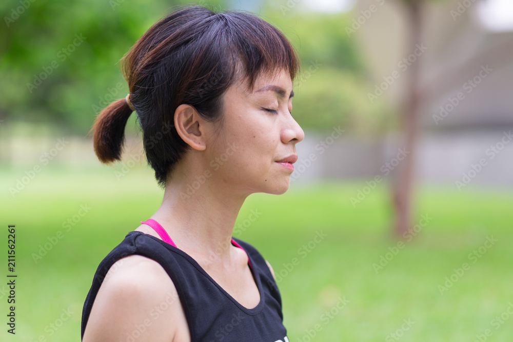 Young woman meditating in nature Young woman meditating in nature