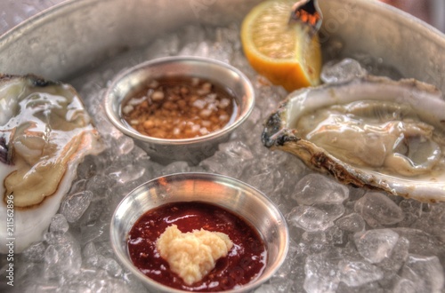 Raw Oysters on Ice with Sauces and Lemon