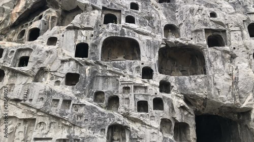 Panning view of the Longmen Grottoes in Luoyang, China